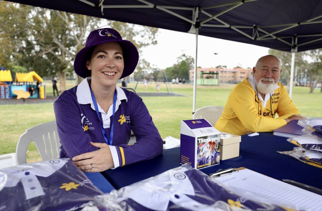 Community relations coordinator for the Illawarra Cancer Council Kelly Dinnerville and committee member Robert Summers at the Beaton Park stall on Saturday.