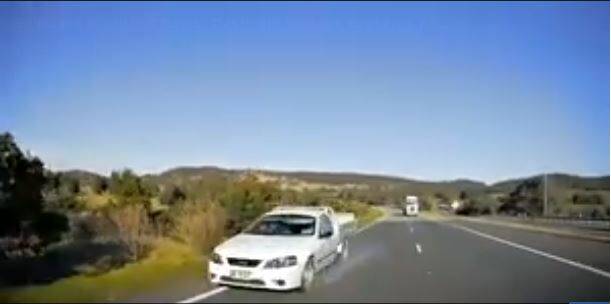 Police have labelled a video of a driver performing a U-turn into oncoming traffic as an act of stupidity. Photo: Dash Cam Owners Australia