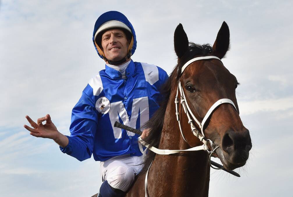 SPRING: Hugh Bowman riding Winx after winning the William Hill Cox Plate at Moonee Valley Racecourse on October 24, 2015. (Photo by Vince Caligiuri/Getty Images)
