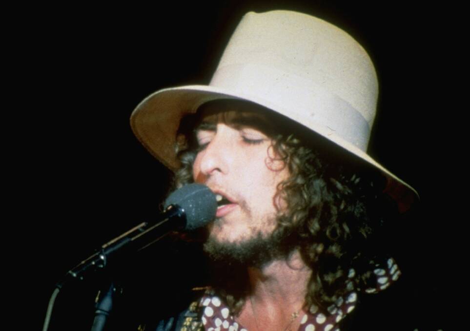 Times they are a-changin': A 28-year-old Bob Dylan performs at a festival in England in 1969. Picture: AP Photo
