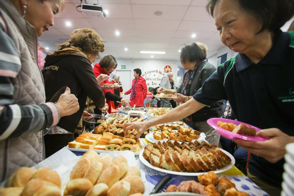 Dig in: The 21st Biggest Morning Tea hosted by the Illawarra Filipino Multicultural Women's Group. Picture: Adam McLean