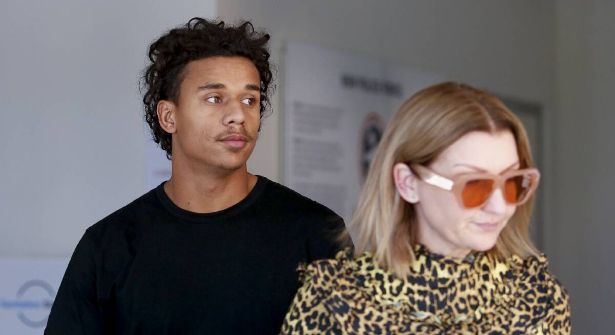 Tristan Sailor leaves Wollongong Police Station on Sunday with his mother, Tara Sailor, after being granted strict conditional bail in court on rape allegations. Picture: Anna Warr.