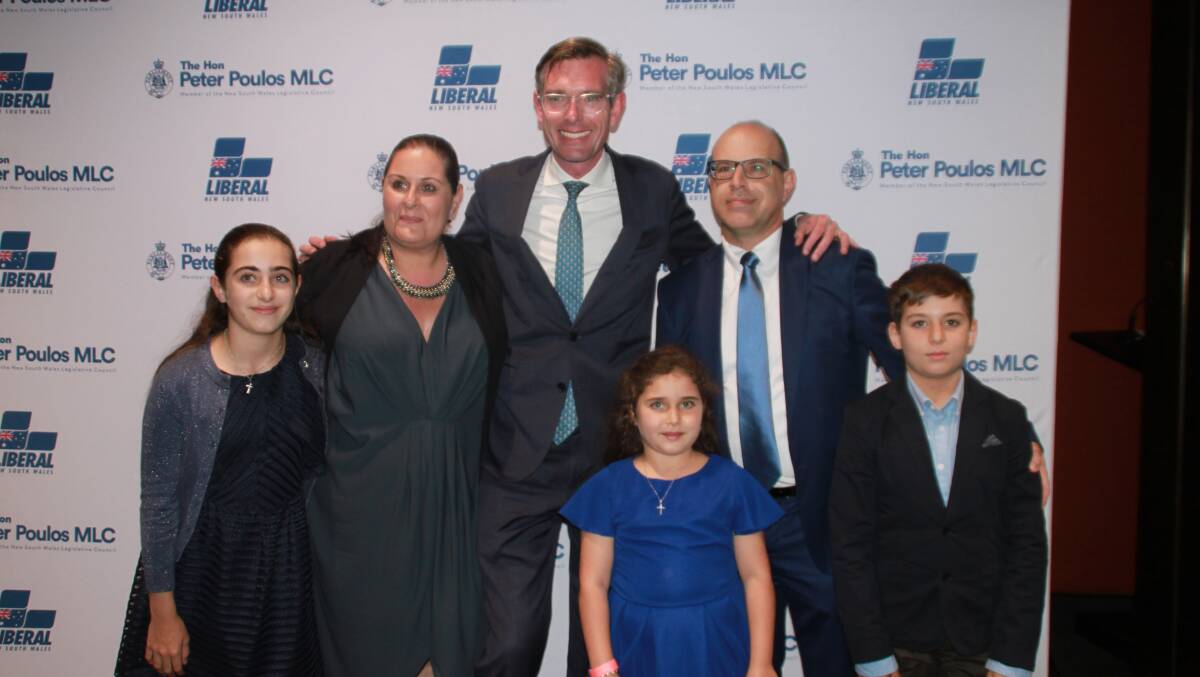 Allies: Peter Poulos (second from right) pictured with his family and 'close friend' NSW Premier Dominic Perrottet.