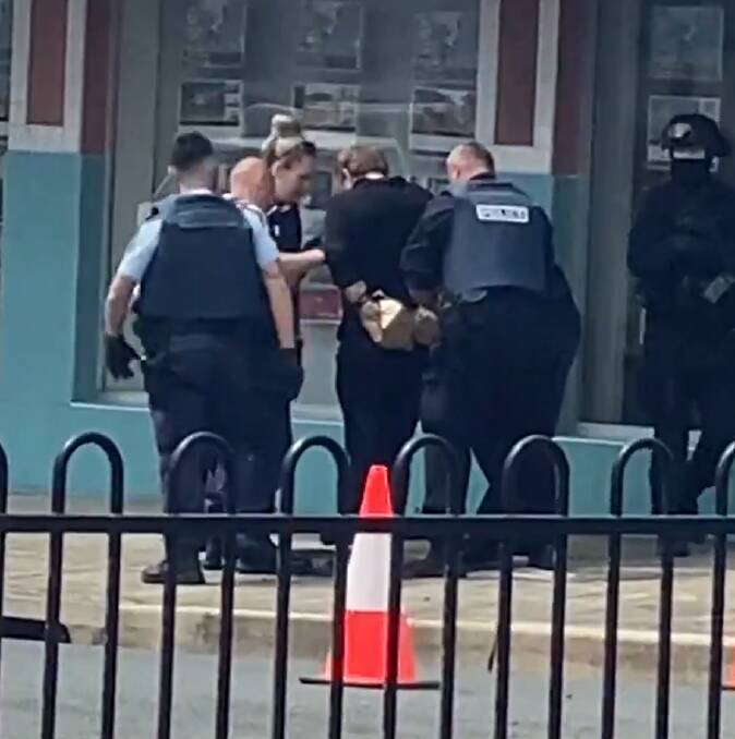 Accused: Police arrest Simon Fleming on Sunday, November 28, after he allegedly shot up a street in Windang. Picture: Shannon Tonkin