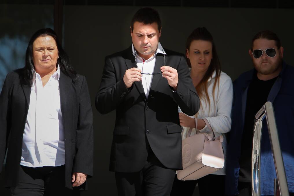 Matthew Domio (centre) leaves Wollongong courthouse in August 2016 during his first trial.