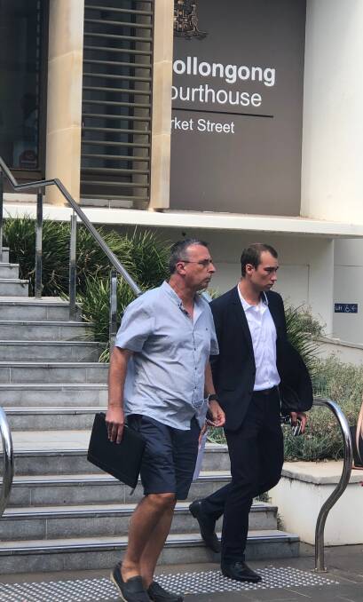 Andrew Page (right) leaves Wollongong courthouse on Tuesday accompanied by his father.