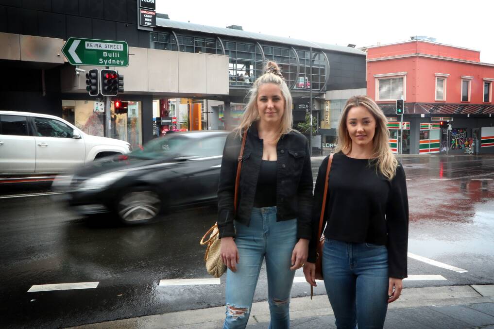 Thumbs up: Illawarra sisters Amanda and Jessica Bergin have welcomed Uber's decision to introduce a 'panic button' to their app that allows drivers and passengers to contact 000 if they feel unsafe. Picture: Sylvia Liber.