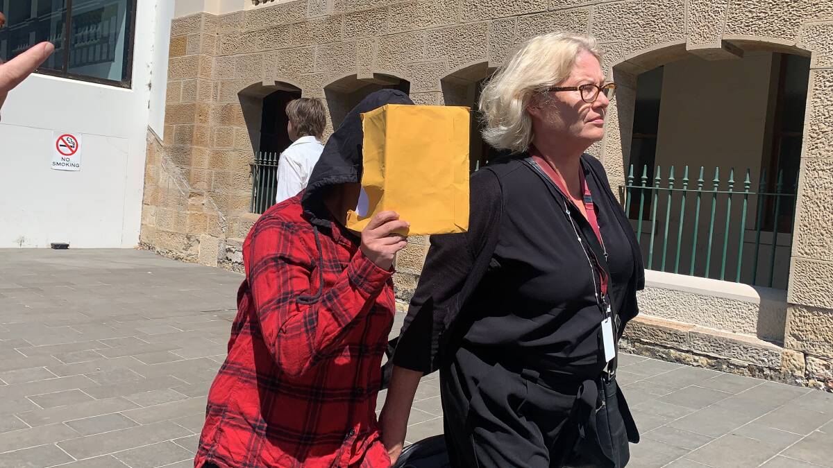 Significant danger: The boy's biological mother (red shirt) leaves Wollongong courthouse on Wednesday with her lawyer, Laura Fennell, after pleading guilty to a serious neglect charge.