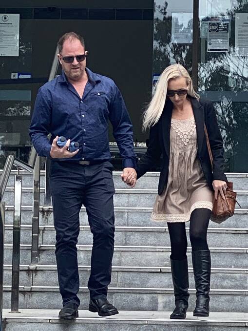Truck driver Jade Sinclair (left) leaves Wollongong courthouse with his partner after giving evidence in Graham Squires' trial on Tuesday.