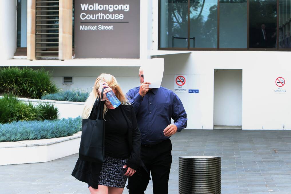 Hiding: Rinaldo Mammone (right) and his supporter weren't keen to be photographed as they left Wollongong courthouse on Friday after the judge passed sentence.