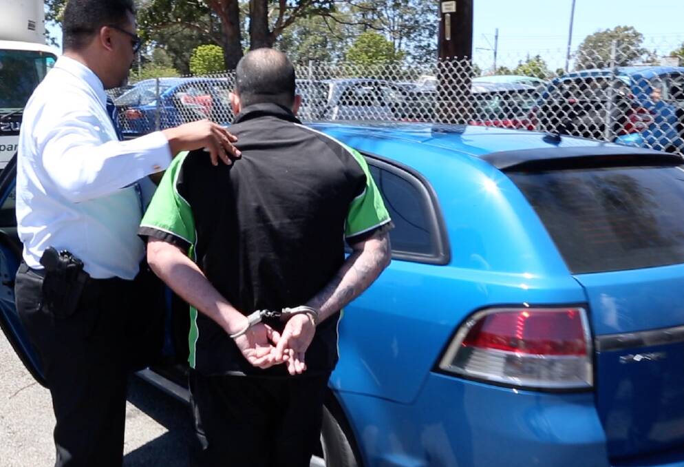 Charged: Zachary Chie is arrested at his workplace in Hamilton Street, Dapto. Police will allege they discovered cash, drugs and a sledgehammer in his car. 