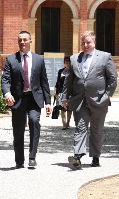 Accused: Robert Nikolovski (left) leaves Goulburn Local Court with his lawyer, Aaron Kernaghan, after having his bail continued until February. Picture: Shannon Tonkin