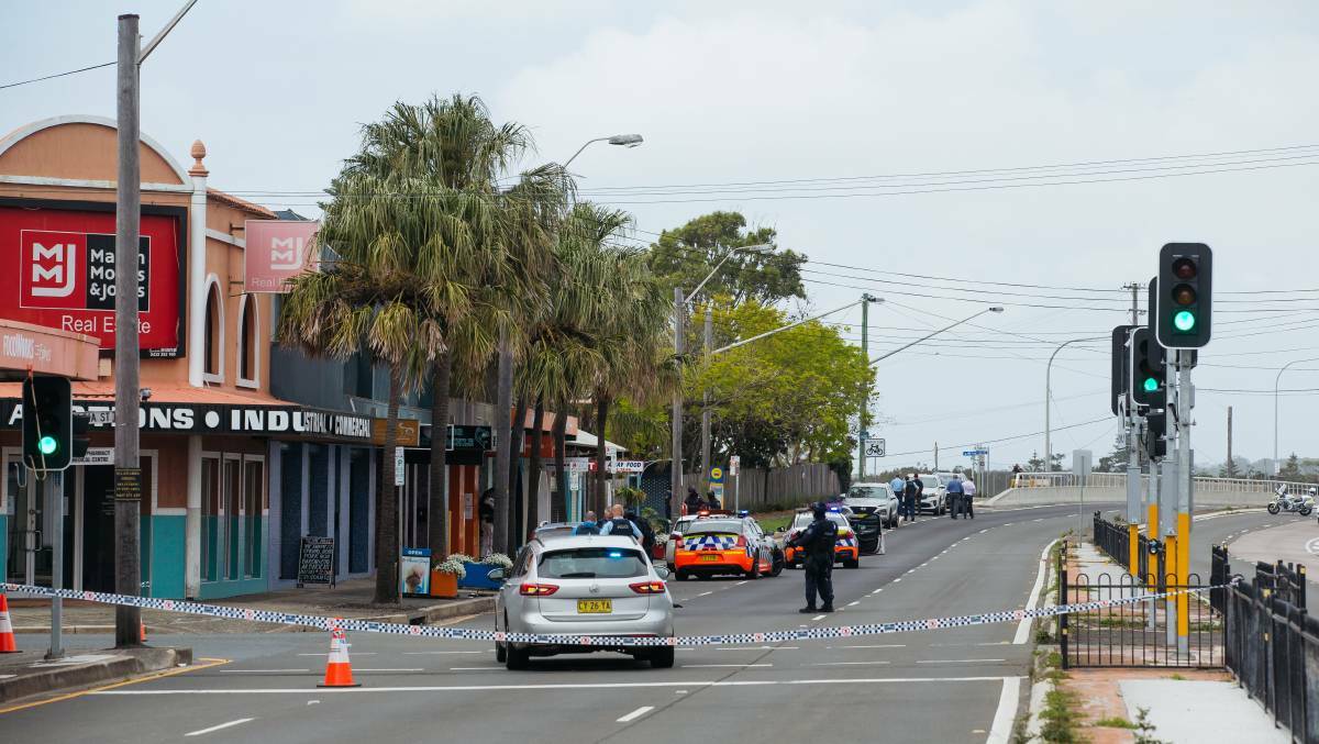The scene: Police work in the cordoned off area at Windang on the day of the shooting. Picture: Wesley Lenergan.