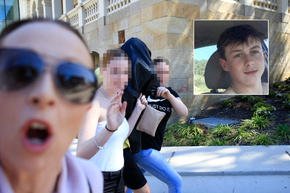 Accused: Dylan Lewis (pictured centre, and inset) is hidden from view by friends as he leaves Wollongong courthouse on Friday. His mother lashed out at the Mercury's photographer during their exit.