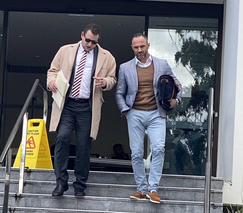 Justin Sydenham (right) leaves Wollongong Local Court on Tuesday with his lawyer, Martin Zanolla.