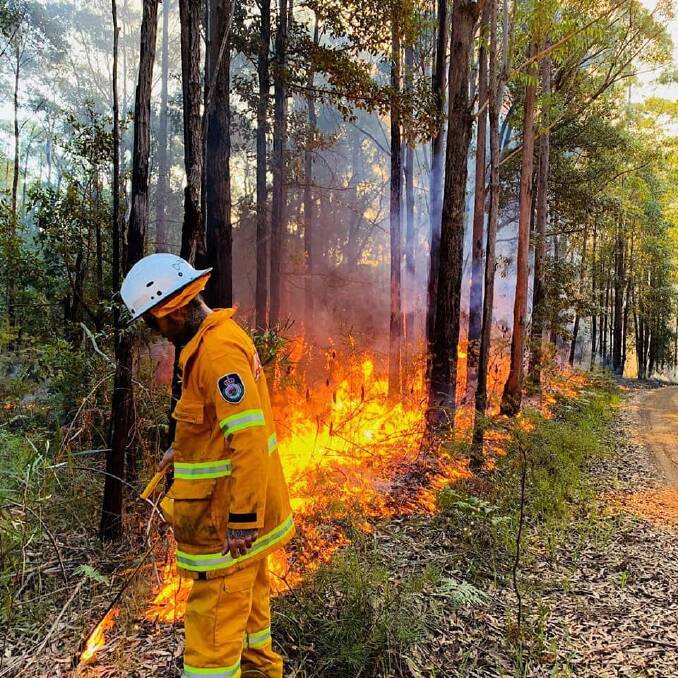 RFS volunteers in the Shoalhaven working hard over the Easter long weekend to contain a bushfire. Picture: RFS - Tomerong Brigade 