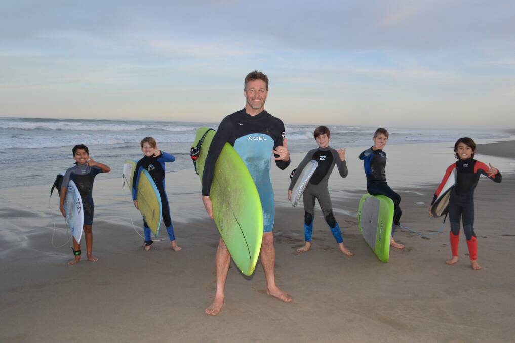 Tristan Gale, Jonah Andrews, instructor Rusty Moran, Oli Shepherd, Oliver West and Sam Le at Berry Beach on Thursday. They hope to be surfing in safer waters by September. Picture: Rebecca Fist