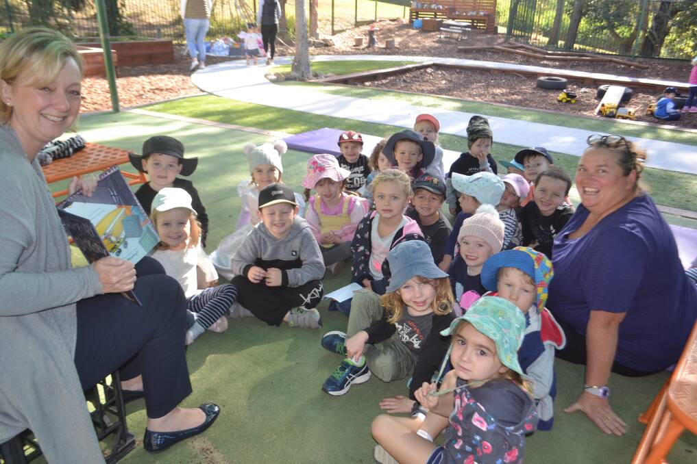 Kids from Big Fat Smile Kiama Downs enjoy a reading from Sophie Ray on Wednesday morning. Picture: Rebecca Fist