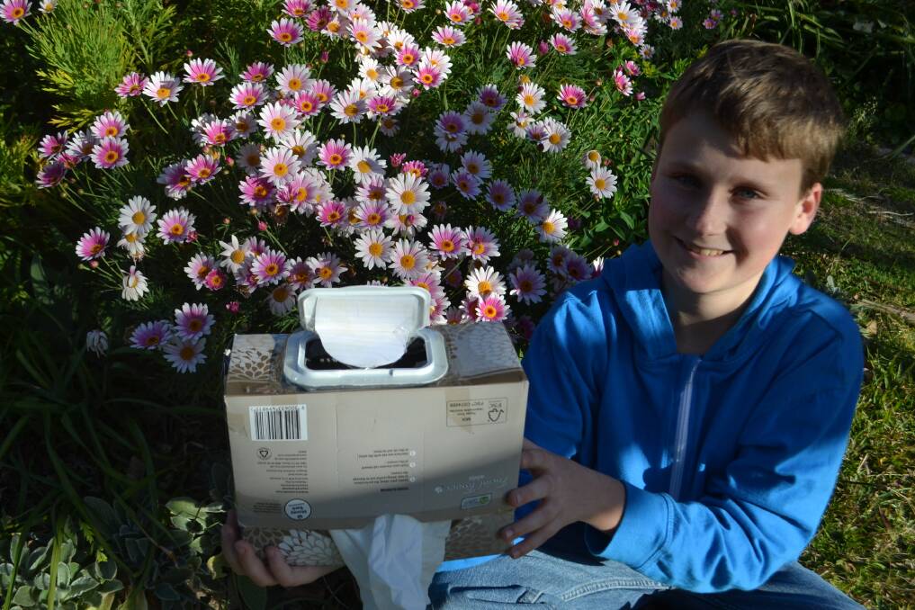 TIDY IDEA: Jamberoo's Eric Saunders, 12, invents a bin within a tissue box. It could win him a trip to the US. Entries remain open for kids in years three to eight. Picture: Rebecca Fist