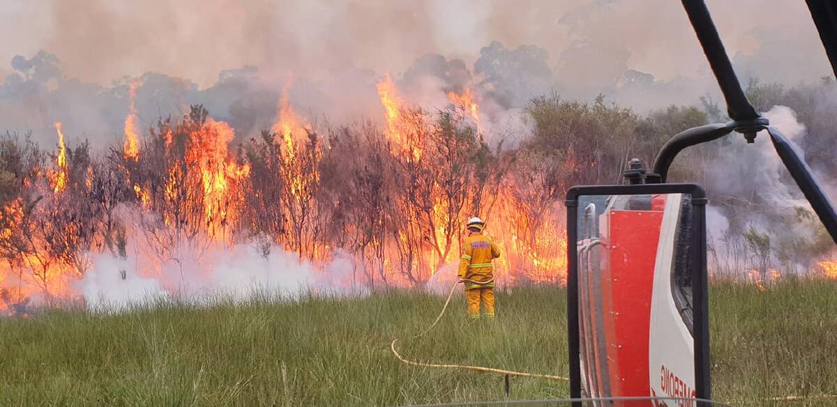 RFS volunteers in the Shoalhaven working hard over the Easter long weekend to contain a bushfire. Picture: RFS - Tomerong Brigade 