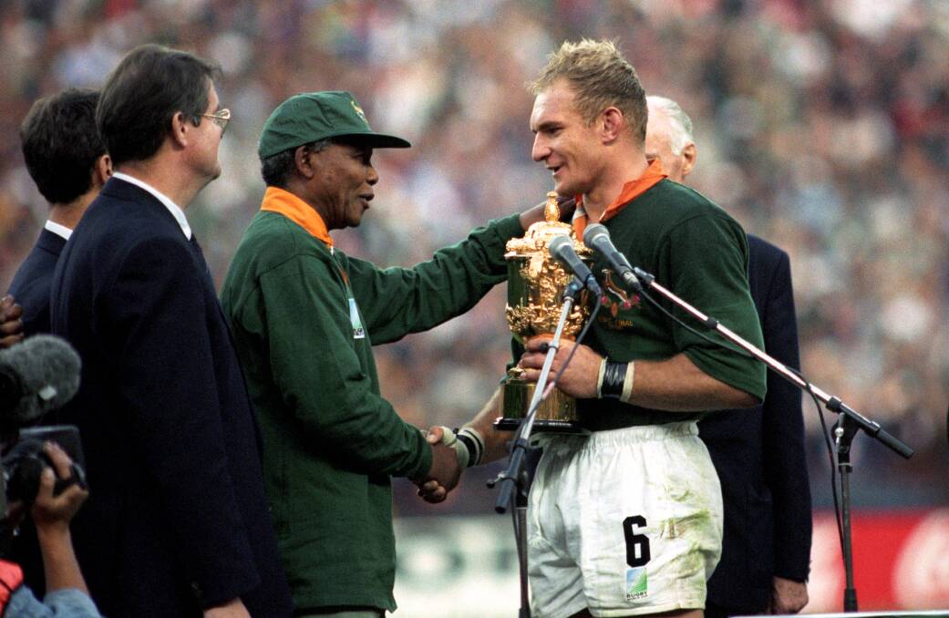 Nelson Mandela congratulates Springboks captain Francois Pienaar after South Africa's historic 1995 Rugby World Cup win. Picture: Getty Images
