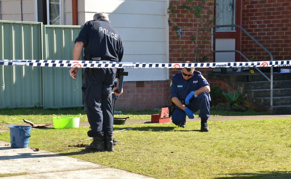 Crime scene officers used metal detectors to search the front lawn of a home in North Nowra in 2017 after a man was allegedly stabbed.