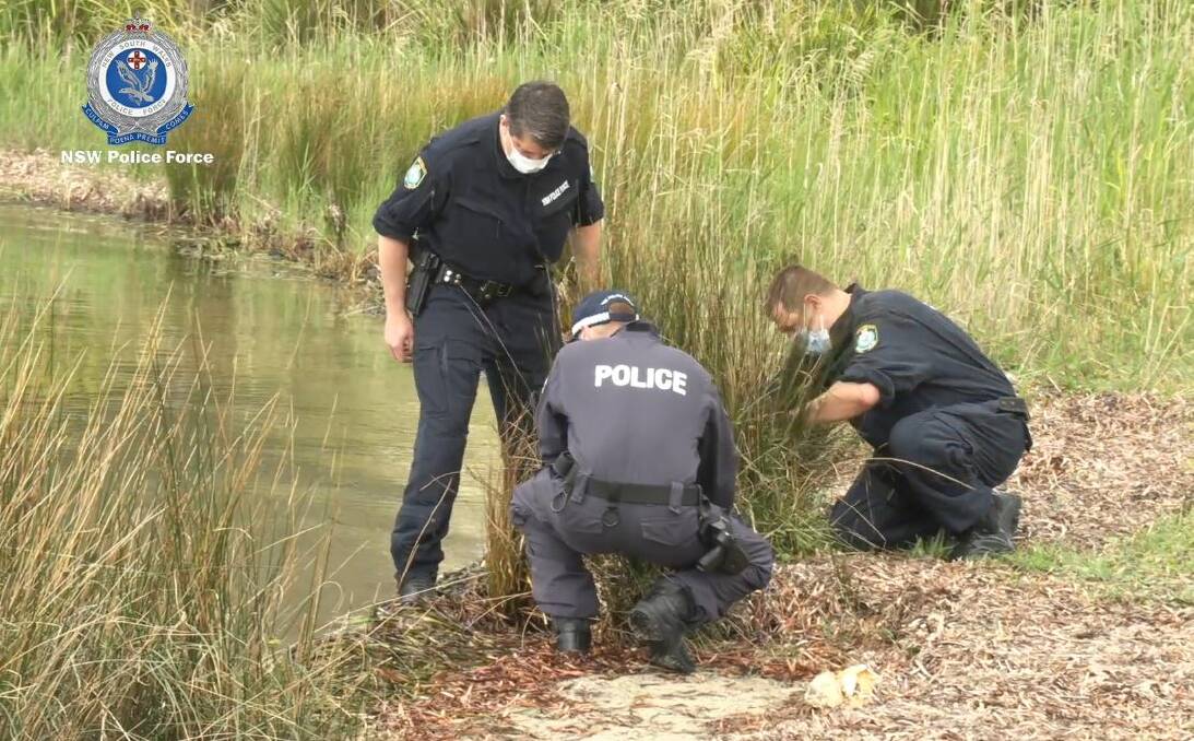 OPERATION: Homicide Squad detectives and South Coast Police District officers search waters around the Sanctuary Point Boat Ramp on Wednesday. Image: NSW Police