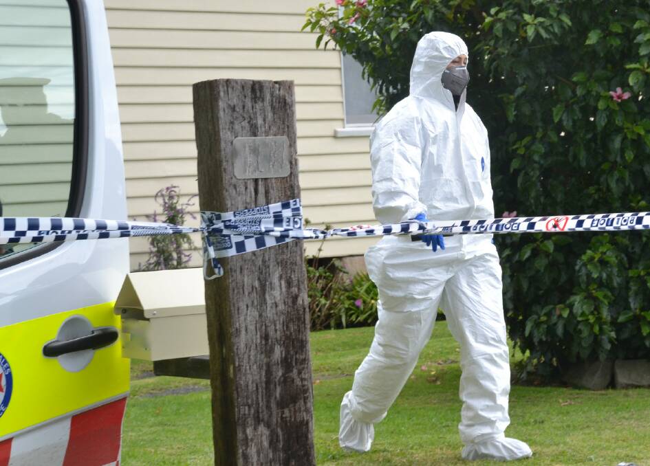 A forensic officer at the Numbaa home.