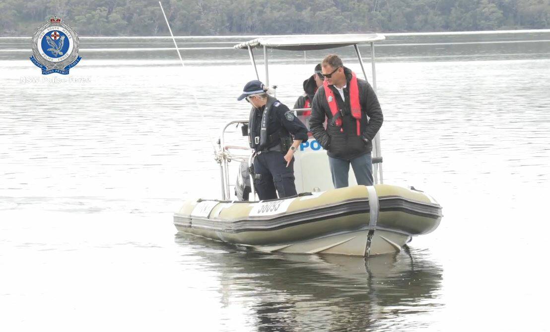 SEARCH: Homicide Squad detectives and South Coast Police District officers search waters around the Sanctuary Point Boat Ramp on Wednesday. Photos: NSW Police