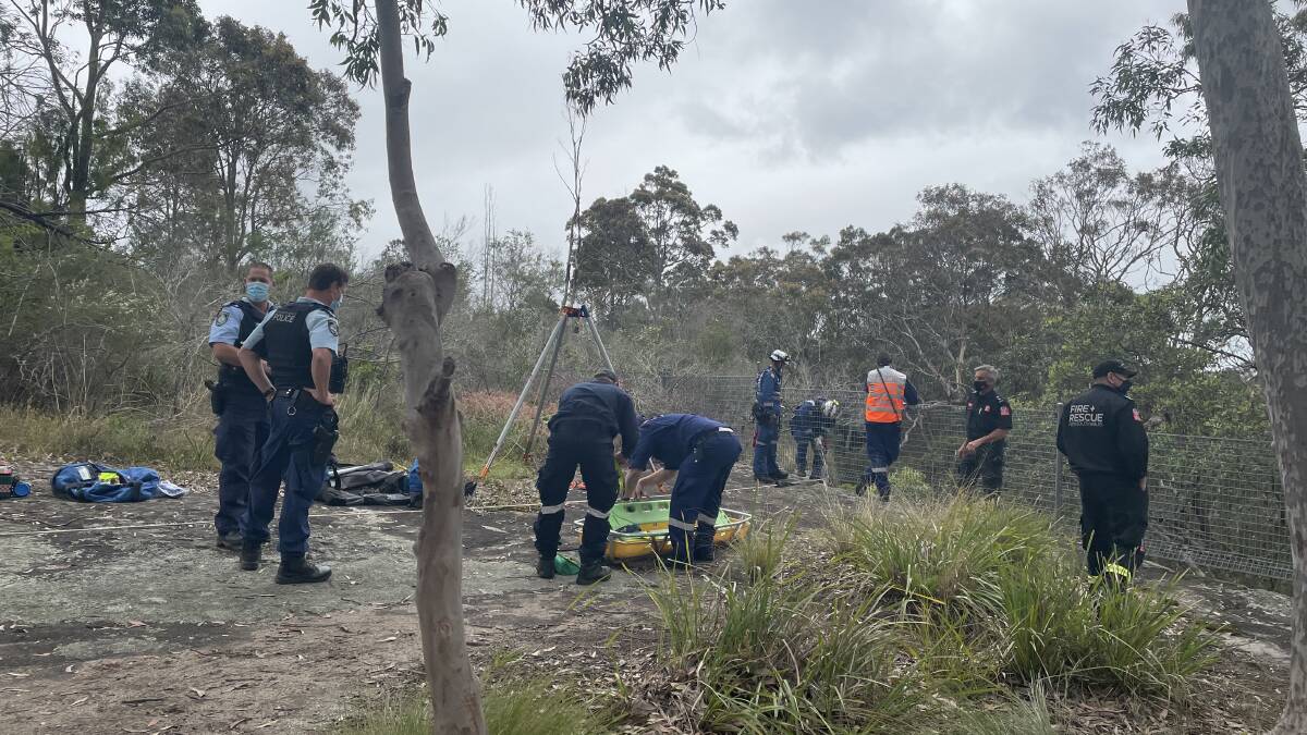 Emergency services at Yurunga Drive North Nowra, where a woman has fallen 10 metres over a cliff. Photo: Grace Crivellaro