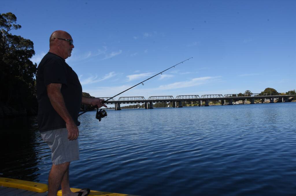 Nowra fisho Alan Hoffman drops a line in the Shoalhaven River on Tuesday. He said he wasn’t  concerned by the EPA's findings and the news wouldn't stop him fishing in the river.