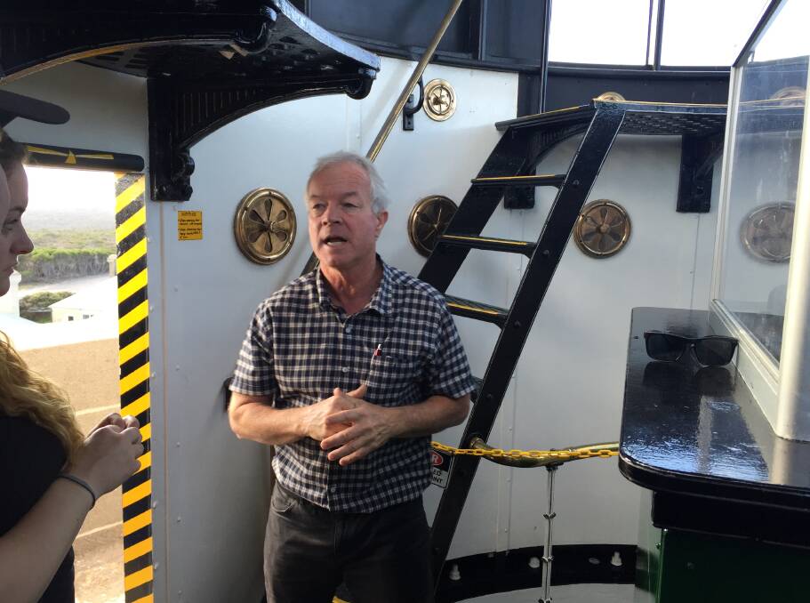 Lighthouses Australia president Ian Clifford conducts a tour inside Point Perpendicular Lighthouse.