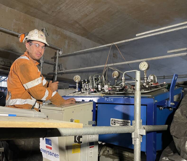 IN CONTROL: Dallas Paterson drives the hydraulic jacks to launch the completed bridge decks.