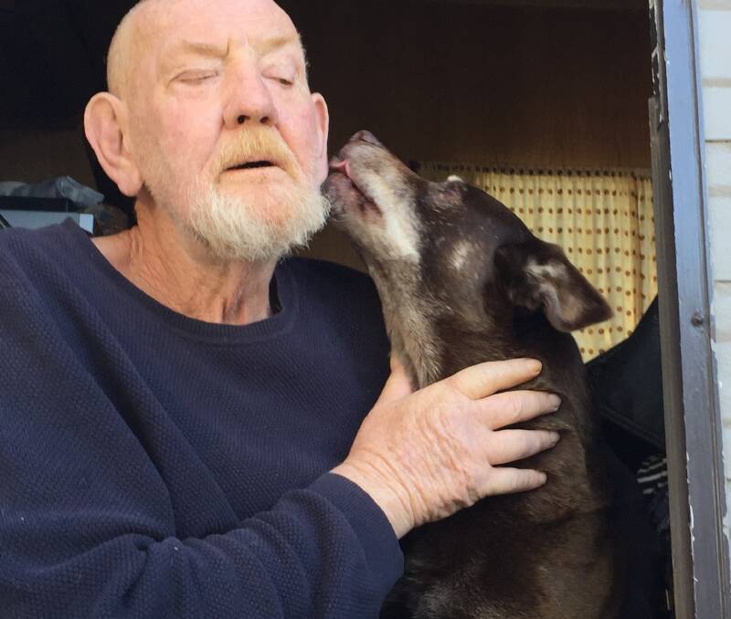 WELCOME HOME: Michael Dadd gets a welcome home lick from his beloved dog Odon.
