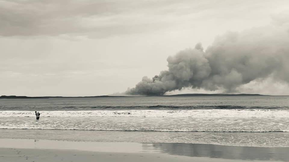 VISIBLE: The Booderee National Park fire from Washerwoman's Beach at Bendalong. Photo: Skye Webb