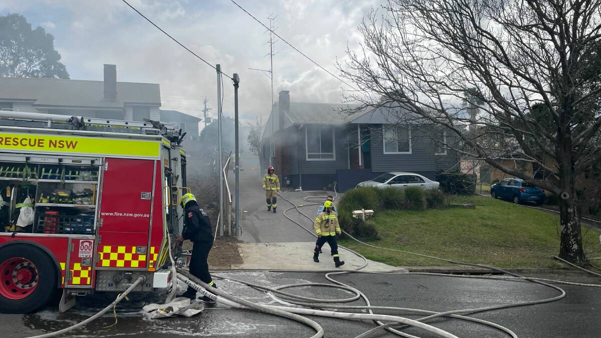 Emergency services rush to a residential on fire on Tresnan Street in Undanderra on Sunday. Picture: Supplied