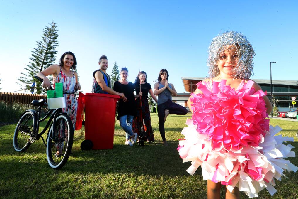 Harper Beaton wears a dance costume made out of repurposed plastic cups. Her mum Courtney Beaton (left) and friends behind with pre-loved items. Picture: Sylvia Liber