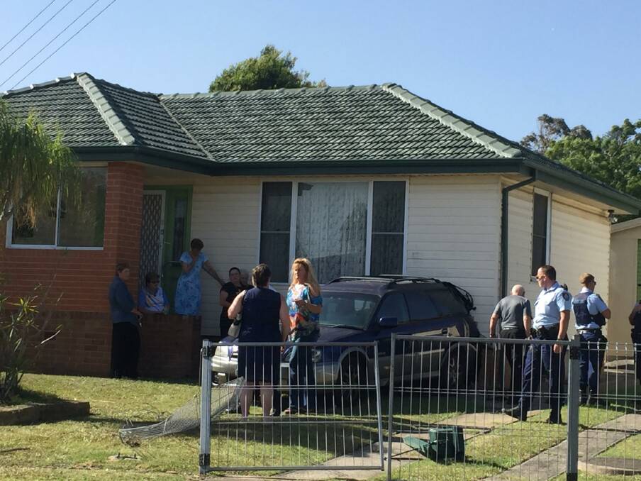 Police investigating the circumstances behind a car reversing into a house in Berkeley on Wednesday. Picture: Sylvia Liber