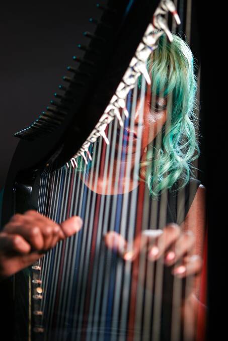 Electric harpist Yasmine Russell loves belting out Guns'n'Roses, Metallica, Ed Sheeran and her own original works. She'll be performing in Port Kembla in January. Picture: Adam McLean