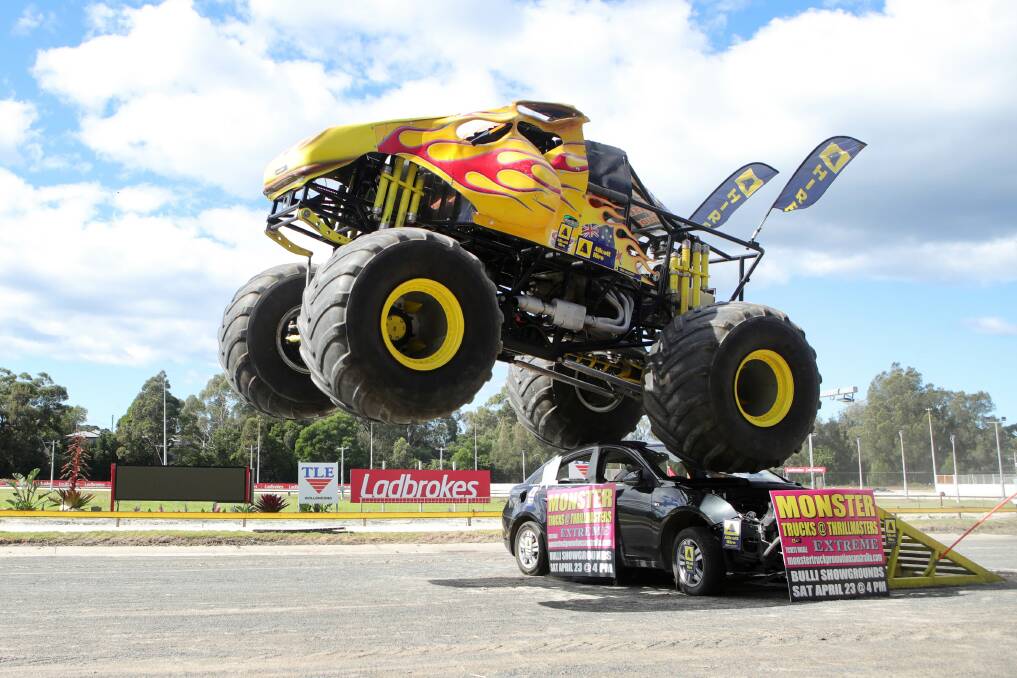 BIG FEAT: Clive Featherby driving his Outback Thunda monster truck on Wednesday at Bulli Showground. Picture: Sylvia Liber