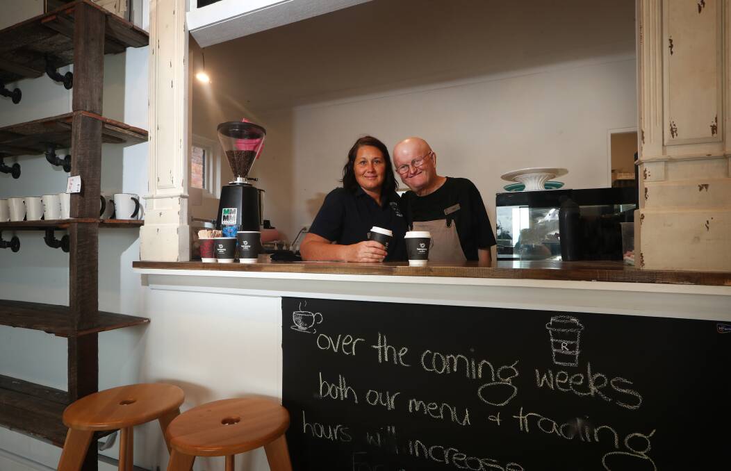 RATHA'S PLACE: Manager Meaghan Pritchard with Max Lukmann at the newly opened cafe on Central Avenue on Oak Flats on Monday. Picture: Sylvia Liber