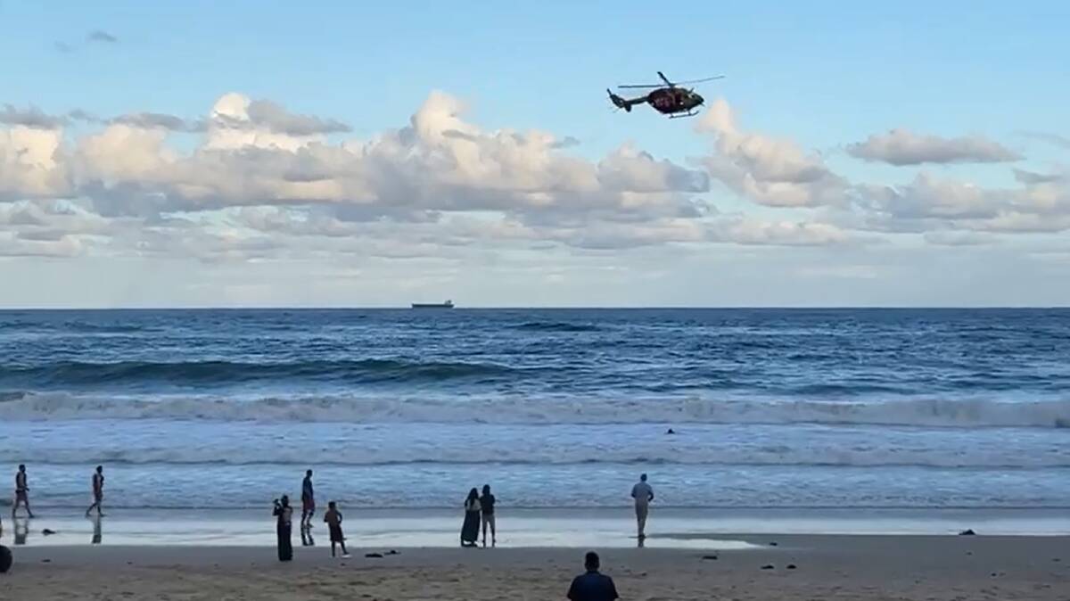 ON SCENE: A rescue helicopter conducts a "sweep" at Tuesday evening at North Wollongong Beach, checking no other beachgoers had gotten into trouble. Picture: Supplied