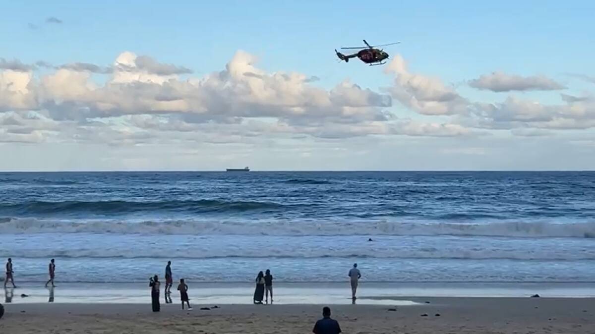 ON SCENE: A rescue helicopter conducts a "sweep" at Tuesday evening at North Wollongong Beach, checking no other beachgoers had gotten into trouble. Picture: North Gong Daily