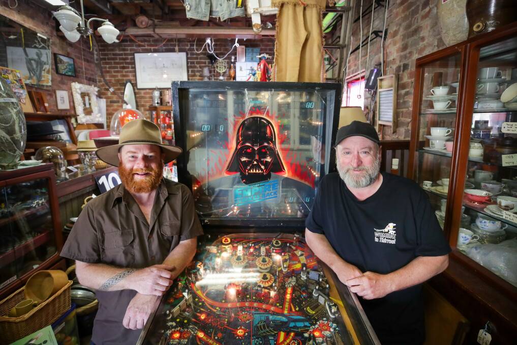 Lindsay and Russell with one of the first Star Wars Pinball machines - a recent rare find - of which only 350 were ever made. Picture by Adam McLean.
