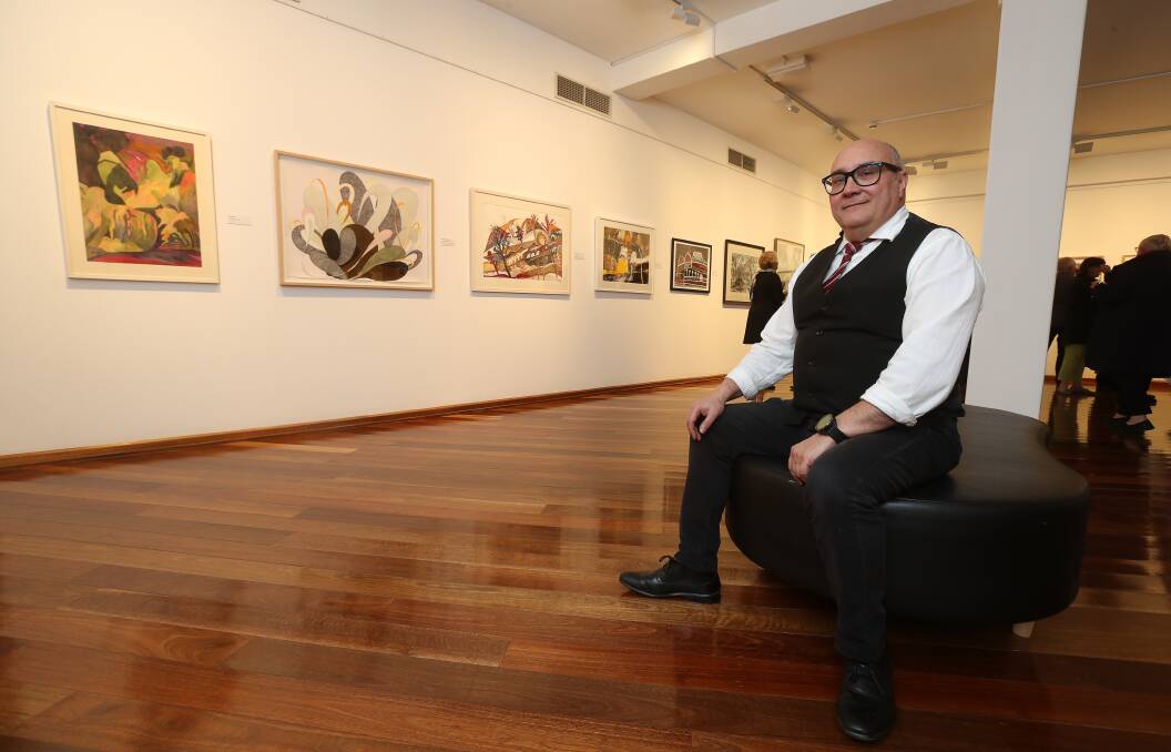 Wollongong Art Gallery director John Moneteleone in front of finalist submissions in the Flow exhibition, which opens to the public on Saturday. Picture: Robert Peet