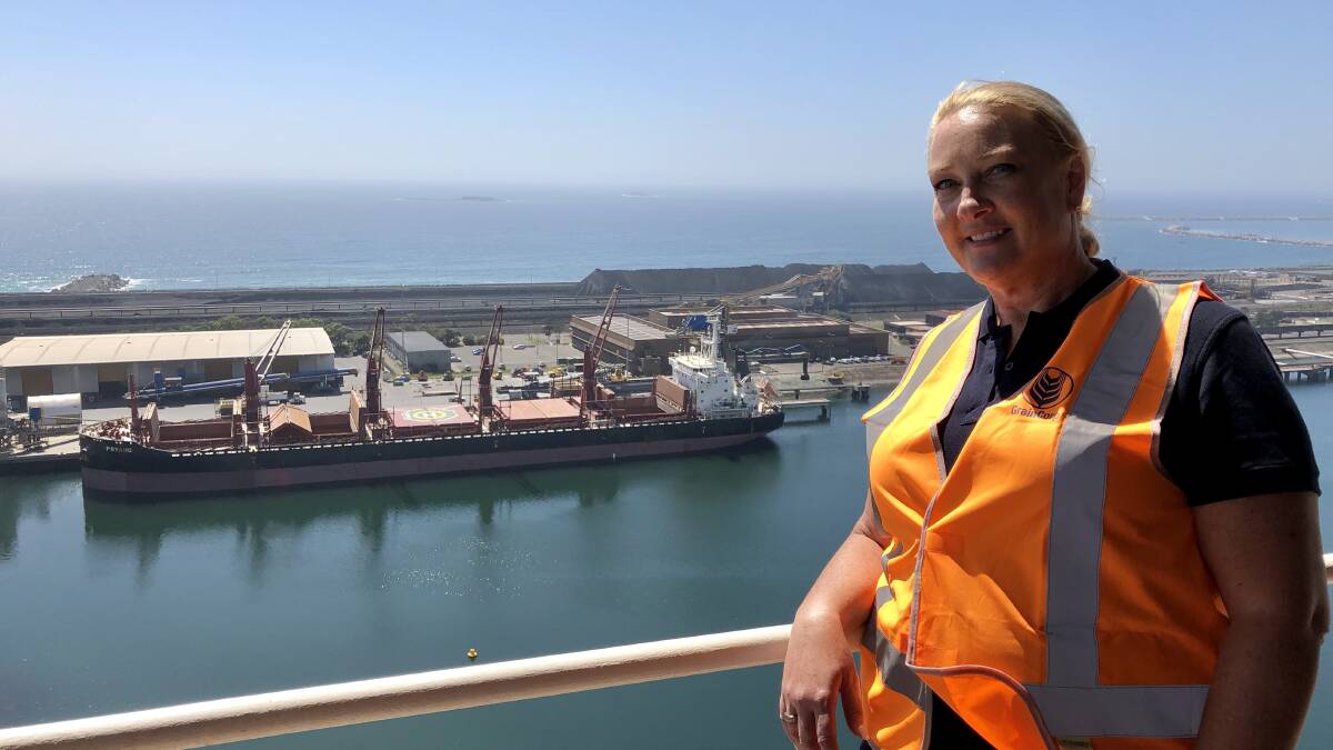 Graincorp port operations manager Stephanie Jurd in front of a ship full of loose grain being unloaded at Port Kembla. A a ship being loaded at Port Kembla takes around two days, to unload a ship at the same port, takes up to 10 days and is weather dependant. Picture: Desiree Savage
