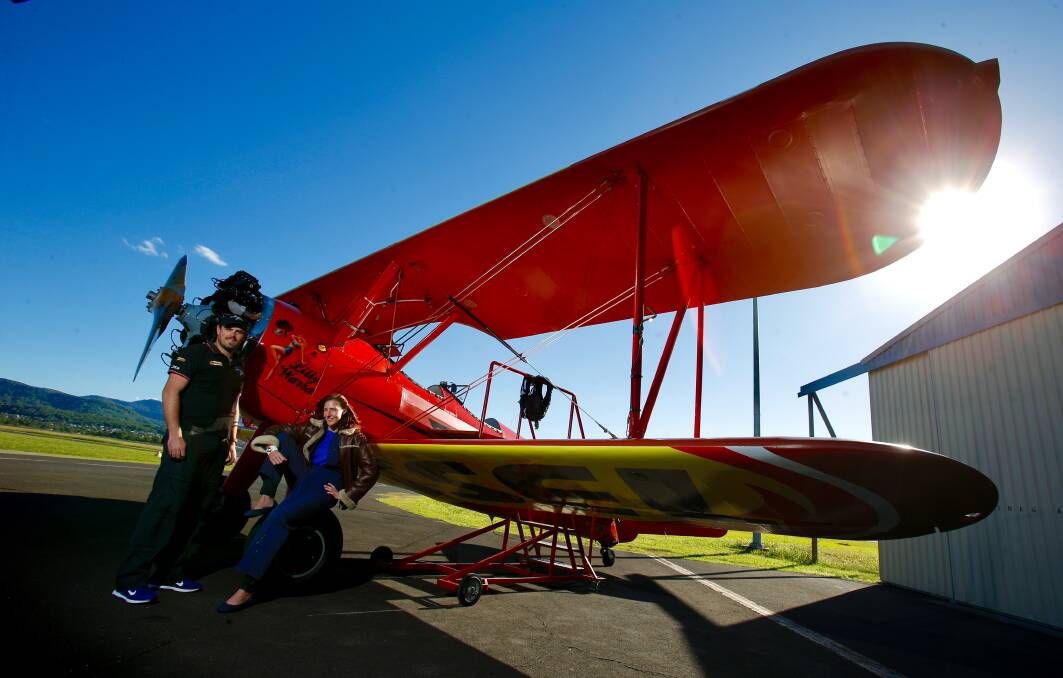 GETTING HIGH: Southern Biplane Adventures pilot Chris Clark puts journalist Desiree Savage through a full aerobatics routine, similar to what you'd see from the ground at the Wings Over Illawarra air show. Picture: Adam McLean