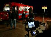A WRAP: Princess Productions film their last scenes in Thirroul on Wednesday night at Thirroul beach with fake fish'n'chips van set. Picture: Adam McLean