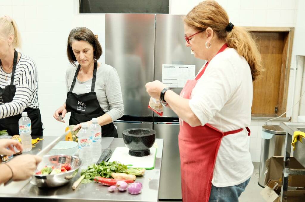 Some of the FLO team earlier this year at a cooking workshop run at Austinmer Anglican Church. Picture: Supplied