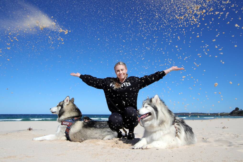 DOG'S DAY: Cassie Briggs. with Alaska and Kato, can't wait to test out the new dog beaches and parks in Shellharbour next year. Picture: Sylvia Liber